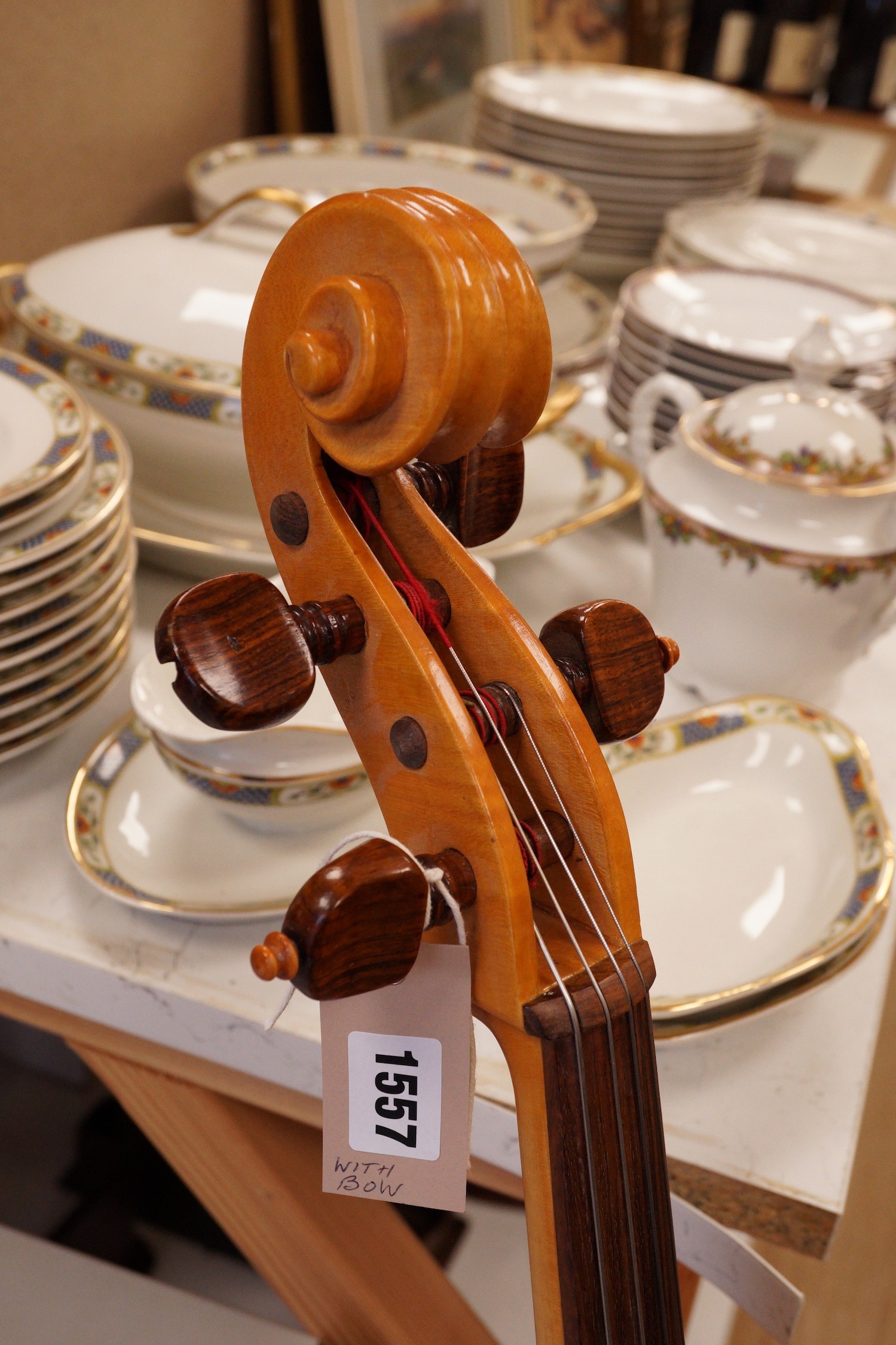 A cello and bow, back measures 73cm